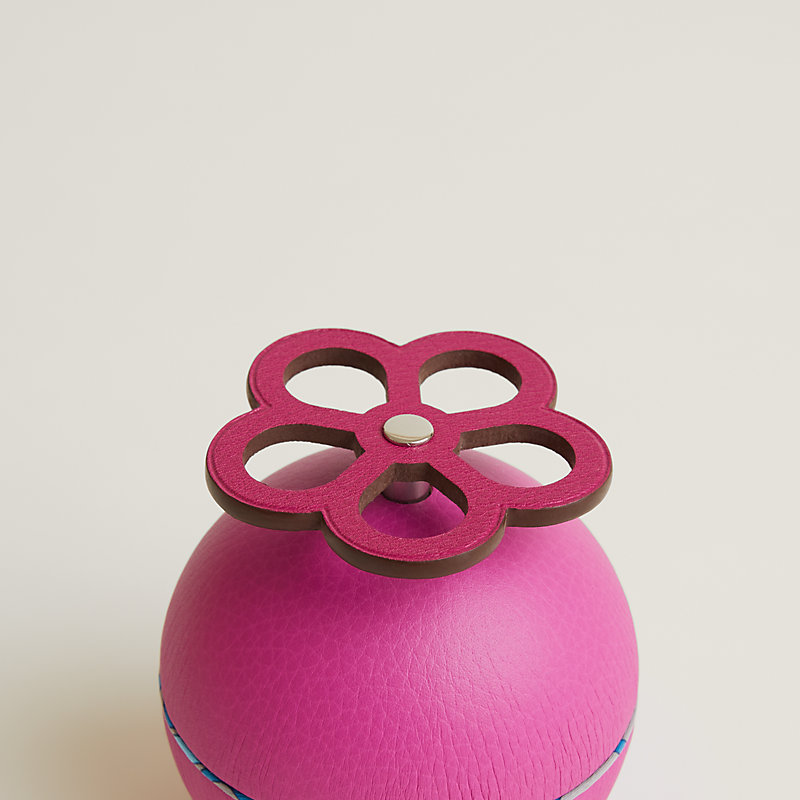 Spherical music box with a fire fighting valve key | Hermès UK